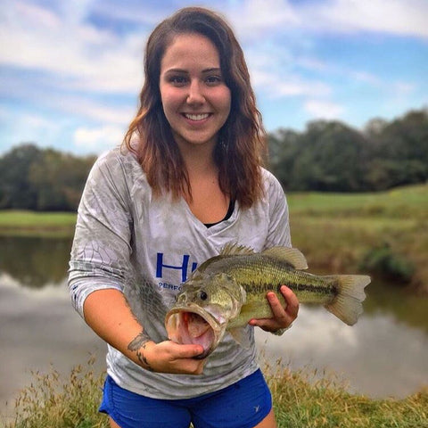 Bay Holding Up Her Catch