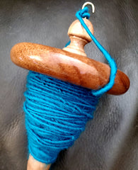 Turquoise yarn spun with drop spindle