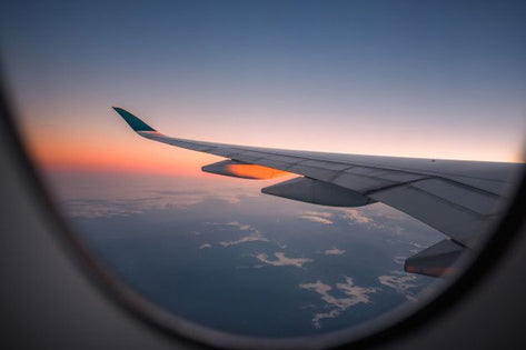 Premium Photo _ Silhouette wing of an airplane at sunrise view through the window_.jpeg__PID:5b3b508f-5a92-491e-9de7-3ba26a27a792