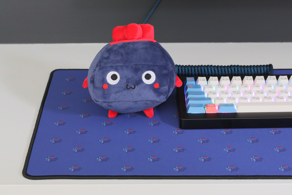 Blue and red plushie of a keyboard switch