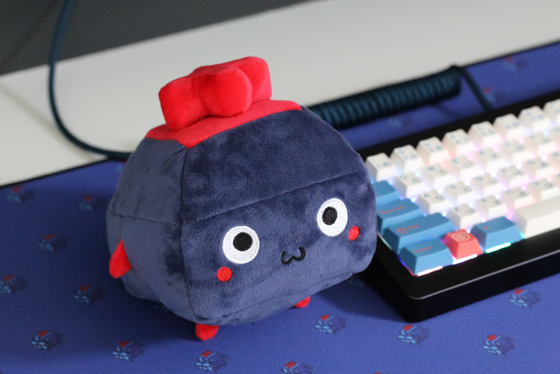 Blue and red plushie of a keyboard switch