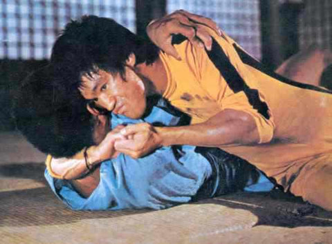 Bruce Lee in Game of Death, using MMA movies before it was cool