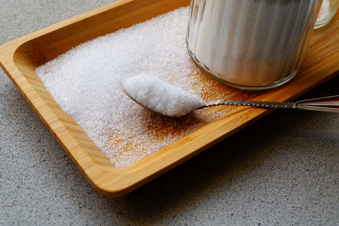 xylitol in powdered form on bowl with spoon