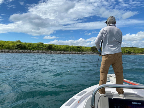 Photo of John Haenke standing on the front of his boat fishing with the Old Dog Lures Rotty Ripper 100mm