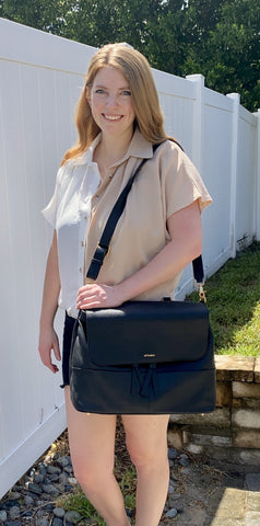 Darcy Fass, pediatric physical therapist from Tips & Pediatricks wearing Alf the Label Luxe Ari Baby Bag as a shoulder bag