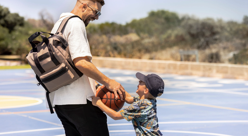 Father and son together with tote backpack