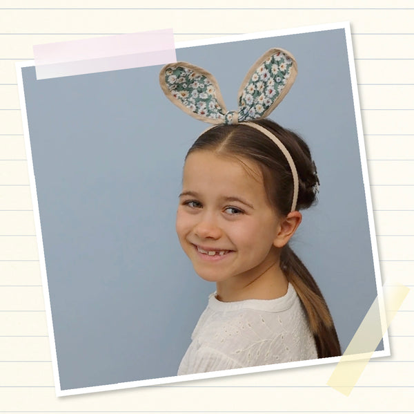 girl wearing bunny ears alice band on head