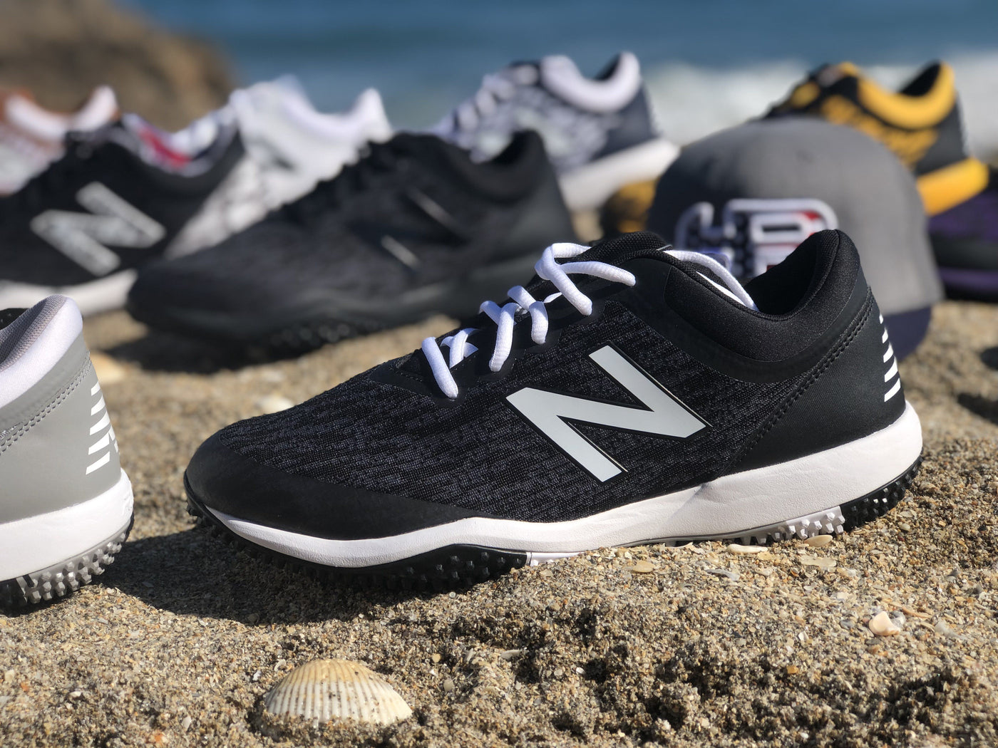 white new balance turfs