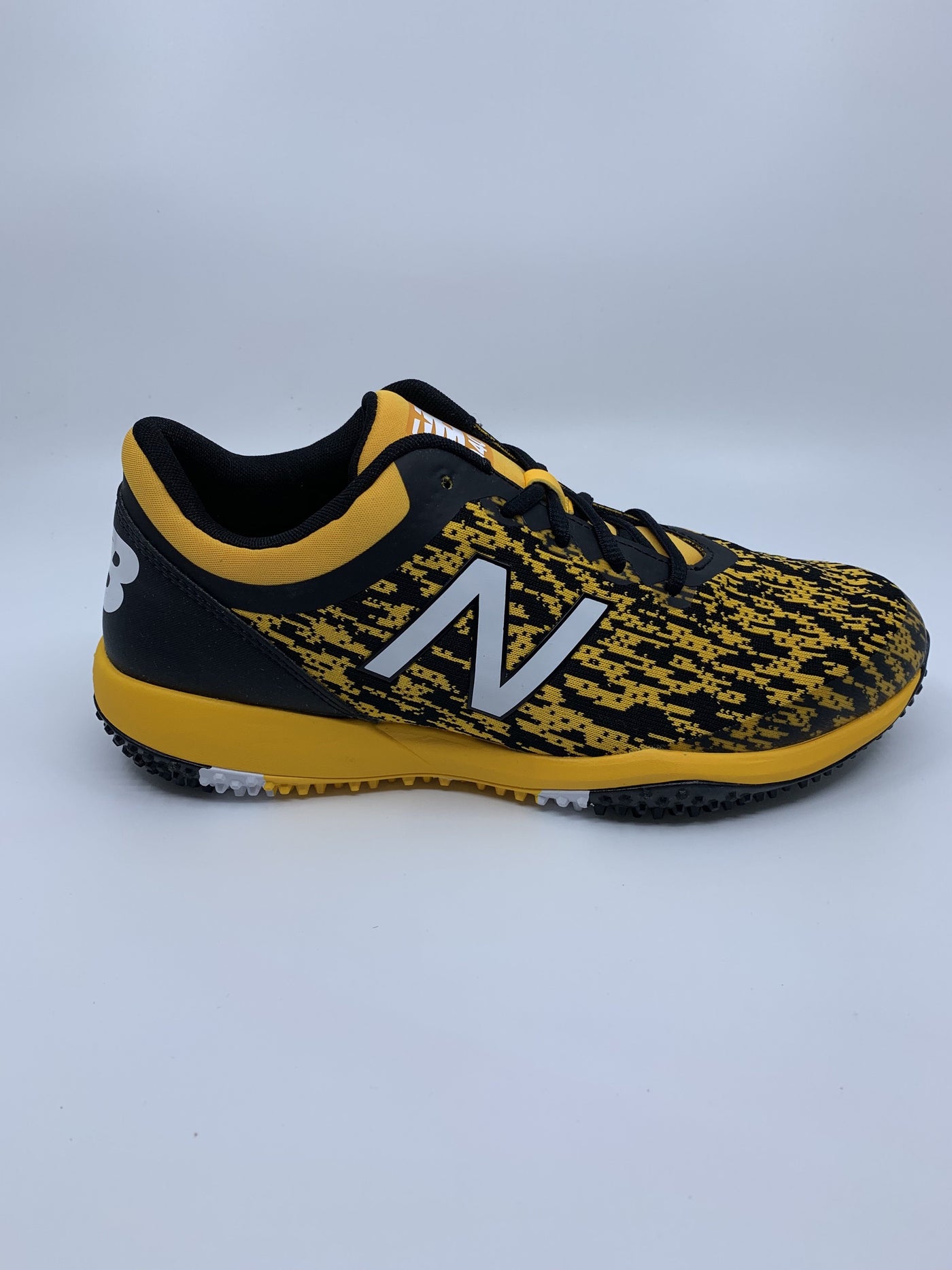 black and yellow turf shoes