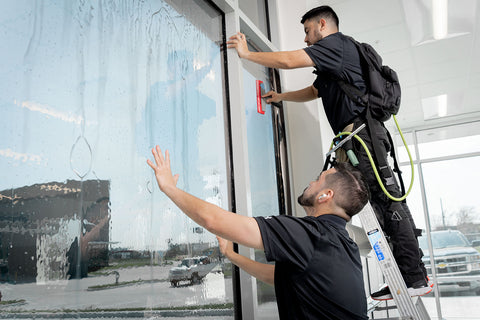 Window tinting a commercial building in Houston, TX by Texas Tint Masters