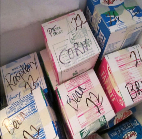 Upclycled milk cartons as freezer containers at Prairie Road Organic Seed