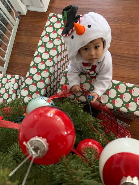 baby wearing snowman outfit