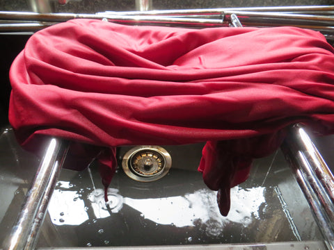 Allowing wet garment to drain before air drying