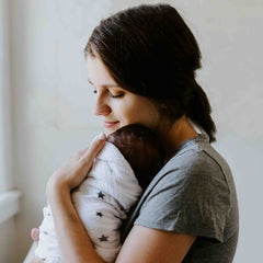 DIY Newborn Photographs - How to take new baby photos.  Fresh 24 photos.  Newborn baby being held by Mum. 