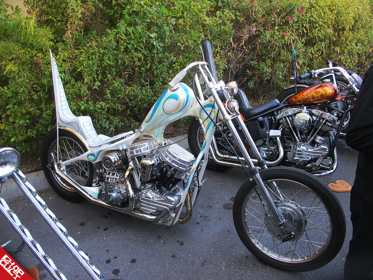 A white bike with glittering aqua and mint green designs at Love Cycles.