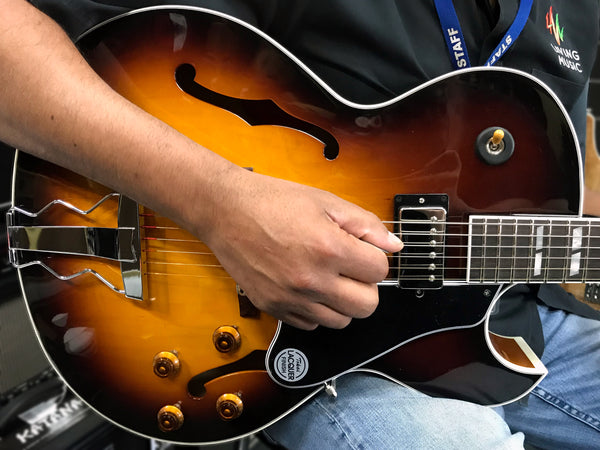 Close up of Rick playing Tokai FA-245-VS guitar