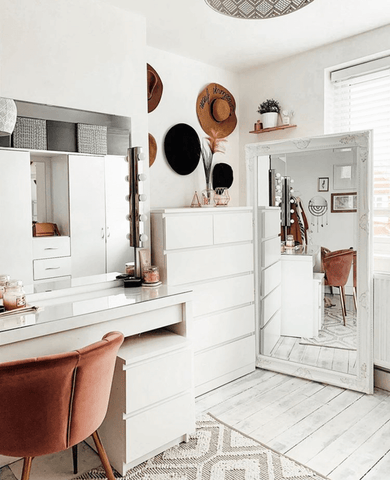 This dressing room has oodles of storage, hidden behind clean, simple lines