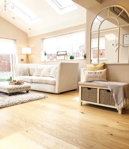 Skylights and a wall mirror bathe the room in natural light