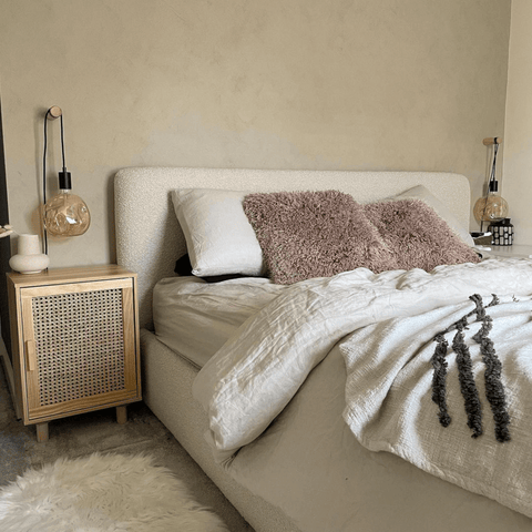 Rattan furniture creates a relaxed, boho vibe that's perfect for a peaceful bedroom.