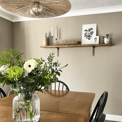 Wooden shelves with black metal brackets look stylishly rustic in every room.