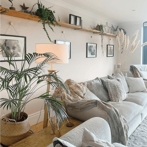 Neutral tones and pops of greenery create a relaxed, Scandi style living area.