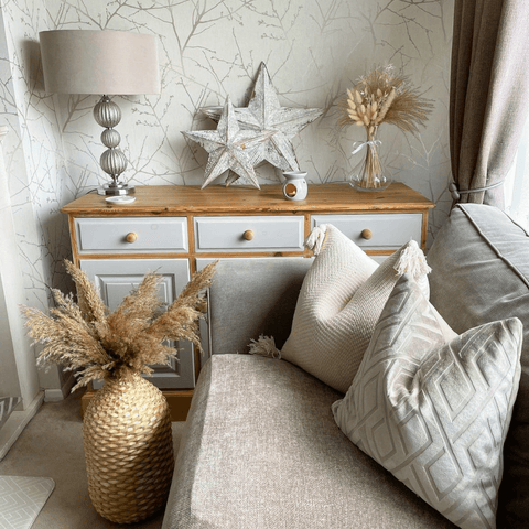 Dried grasses like pampas and bunny tails add warmth and colour to cool neutral schemes.
