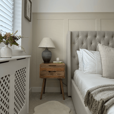 A radiator cover is a great way to create tranquility to your bedroom, while white Egyptian cotton bedding adds a luxurious finishing touch.