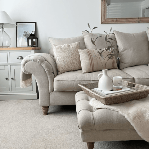 This beautiful chesterfield sofa and footstool are both stylish and cosy.