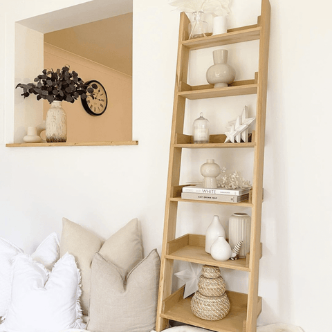 Wooden ladder shelves add a rustic twist to modern living spaces.