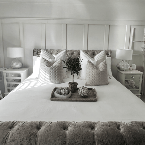 This luxurious monochrome themed bedroom features pure white Hampton and Astley Egyptian cotton sateen bedding.