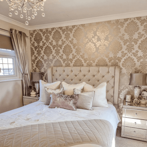 Gold damask wallpaper looks dreamy in this ultra opulent bedroom.
