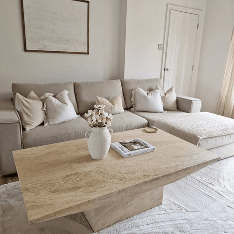 Oatmeal sofas with cream cushions and rugs look oh so cosy and comfortable.
