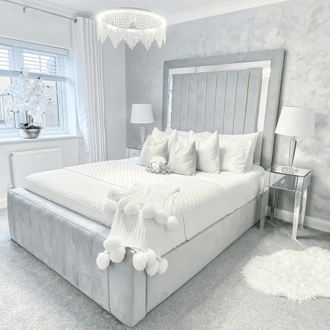 A glitzy chandelier and statement headboard give the main bedroom the wow-factor, along with the Hampton and Astley Egyptian cotton bedding.