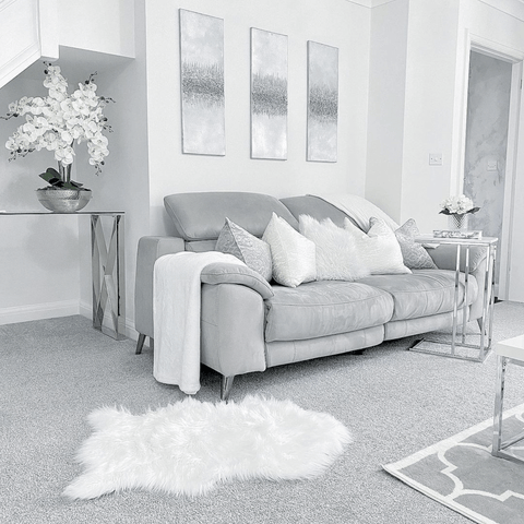 What other colour would the living area be but silvery grey of course, with plenty of white fluffy cushions and rugs to make it feel extra cosy.