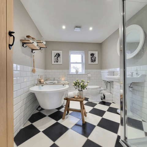 Chessboard floor tiles are a classic choice for a traditional bathroom and can be a real show stopper!