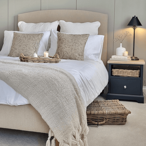 Soft neutral hues blend with pure white Hampton and Astley Egyptian cotton bedding in this country style bedroom.