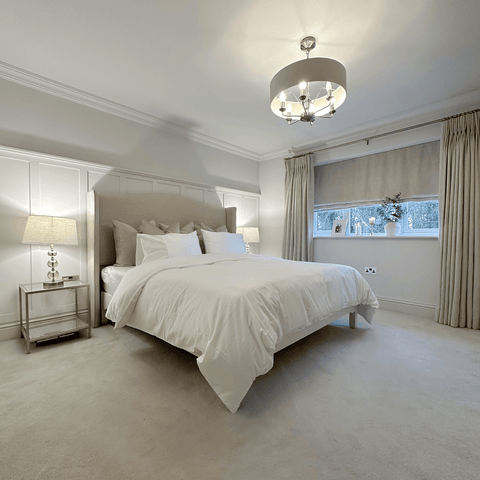 This beautifully restful bedroom features plush, floor-length curtains and pure white Hampton and Astley Egyptian cotton bedding.