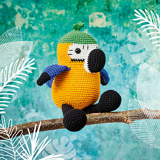 Crocheted Macaw - a yellow, green, blue, black and white bird