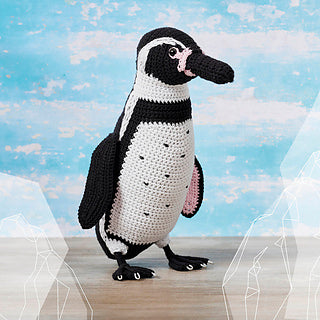 Black and white crochet penguin with pink details