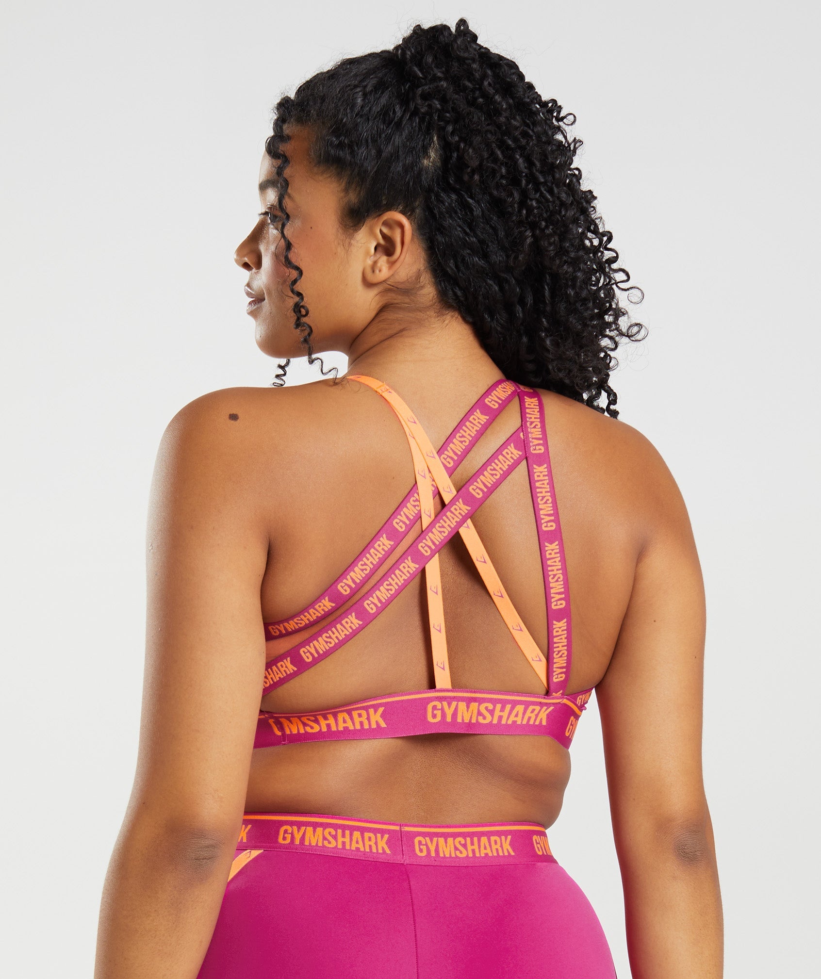 Strike Sports Bra in Dragon Pink/Horizon Orange - view 2