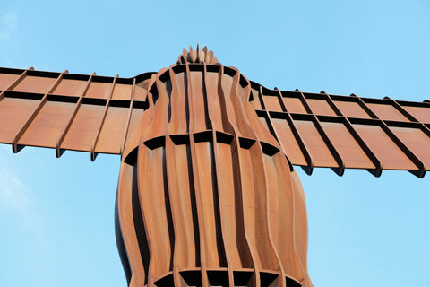 The Angel of the North sculpture by Antony Gormley, standing tall against the North East England sky