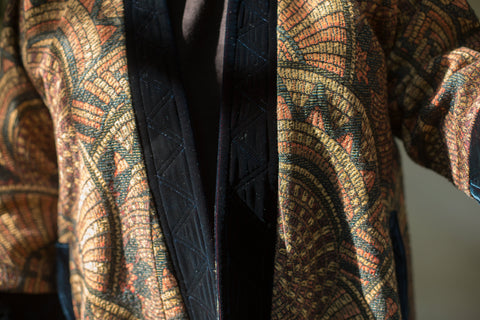 Close up of borders of Turkish Coat - coat is colored jacquard and borders are quilted velvet