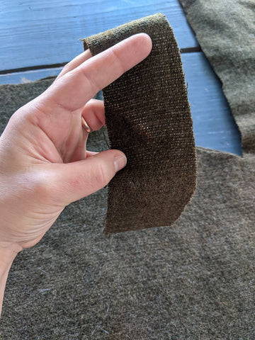 brown wool scrap held up