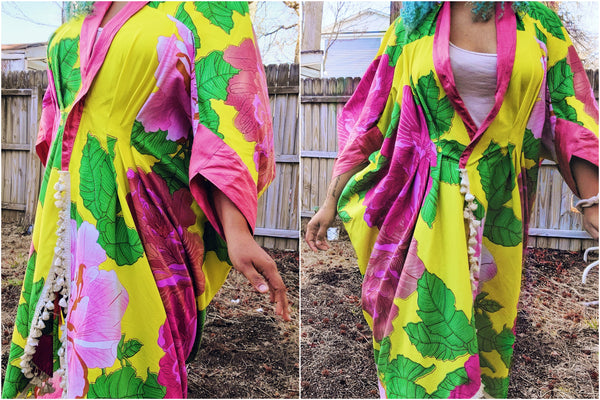 Details of waist tucks on the 503 Poirot Cocoon Coat made of bright yellow and pink African Wax Print.