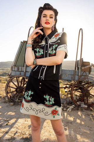 woman wearing a western style skirt with applique and embroidery