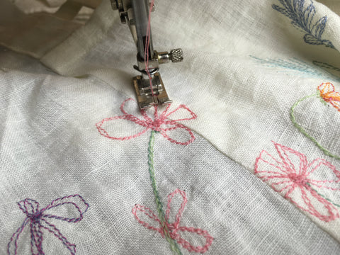 Photo upclose of stitching across the seam on the 213 pinafore design