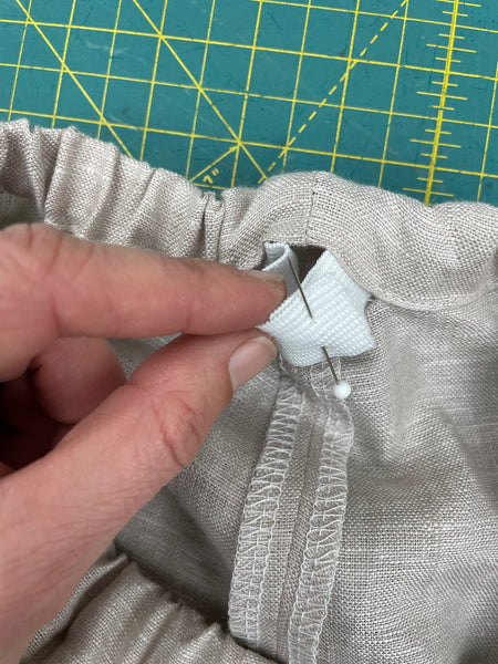 elastic pinned together at back of waistband