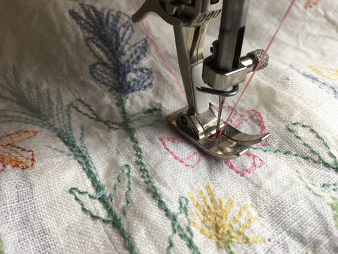 Photo second upclose of stitching the 213 pinafore flower design