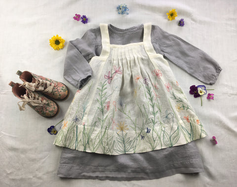 Photo of Folkwear 213 Child's Prairie Dress Pinafore styled with lillac linen dress and boots