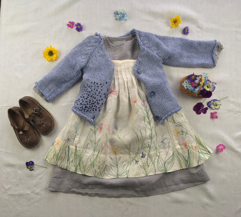 Photo of Folkwear 213 Child's Prairie Dress Pinafore styled with lillac linen dress and blue sweater